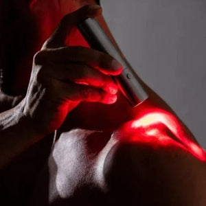 Red light therapy on shoulder