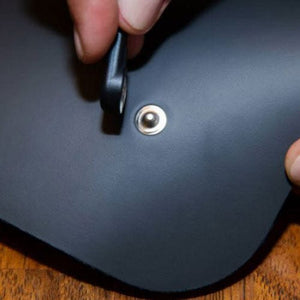 Attaching snap fastener to black leather