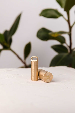Petite brass heal capsule, two visible.