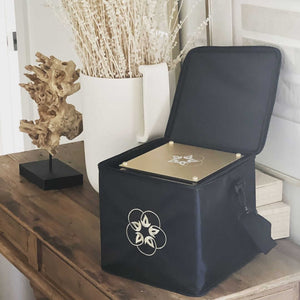 Quantum Infinity Bloc Bag with open lid and gold plate