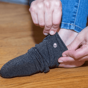 Putting on gray sock (socks1)
