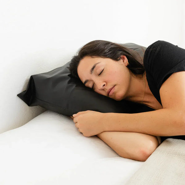 Woman sleeping on an Earthing Pillow Cover